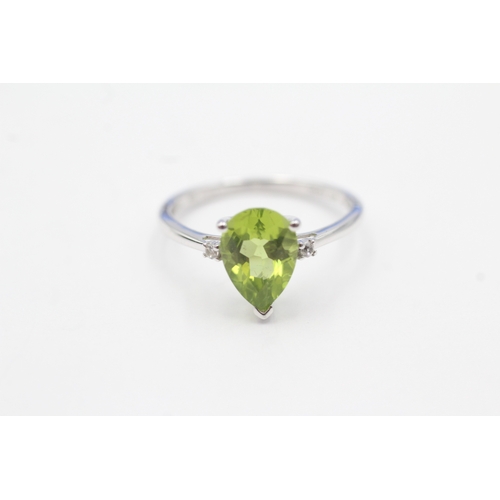 54 - 9ct gold pear cut peridot & white gemstone dress ring (1.8g) Size N