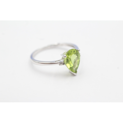 54 - 9ct gold pear cut peridot & white gemstone dress ring (1.8g) Size N