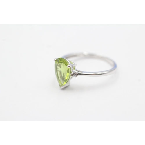 54 - 9ct gold pear cut peridot & white gemstone dress ring (1.8g) Size N