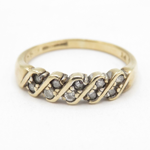 139 - 9ct gold diamond twist ring (1.8g) size M 1/2