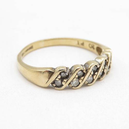 139 - 9ct gold diamond twist ring (1.8g) size M 1/2