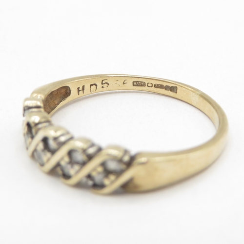 139 - 9ct gold diamond twist ring (1.8g) size M 1/2