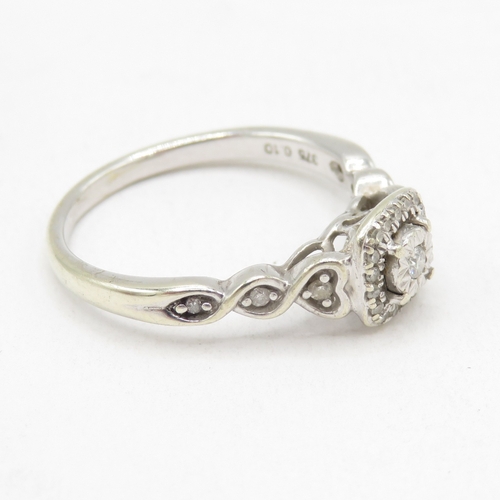 155 - 9ct white gold diamond ring with heart details (2.4g) size L