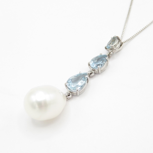 16 - 18ct gold blue topaz and pearl pendant on 9ct gold chain (3.5g)