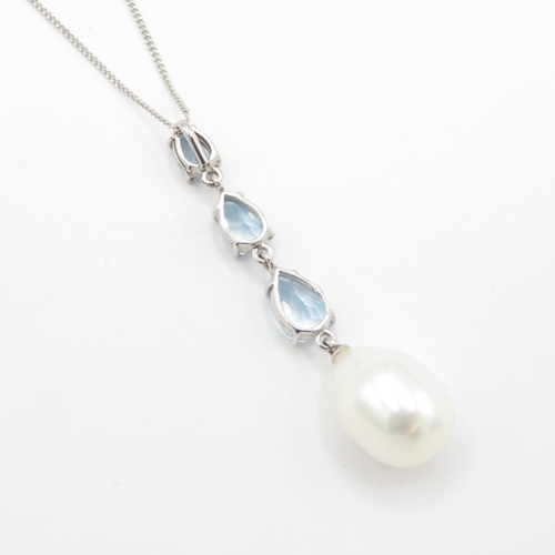 16 - 18ct gold blue topaz and pearl pendant on 9ct gold chain (3.5g)