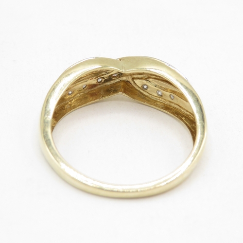 161 - 9ct gold diamond crossover ring (2.8g) size Q