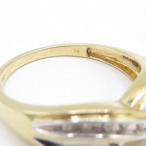 161 - 9ct gold diamond crossover ring (2.8g) size Q