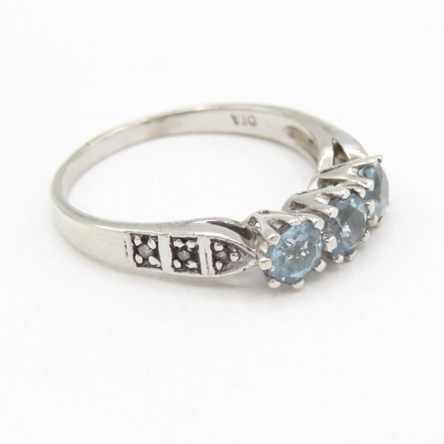 174 - 9ct white gold topaz three stone ring with diamond shoulders (2.8g) size O 1/2