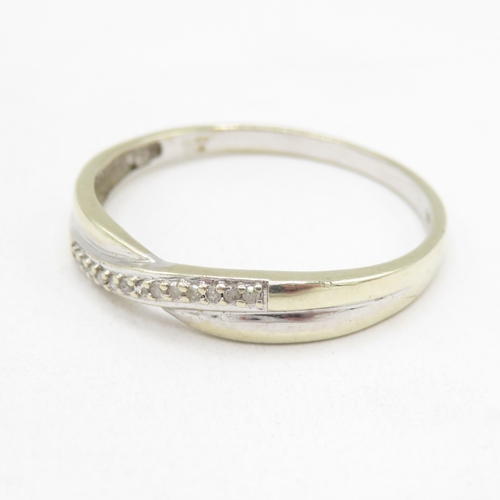 177 - 9ct gold diamond twist ring (1.7g) size T 1/2