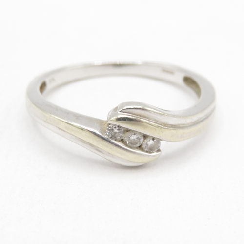 179 - 9ct white gold diamond twist ring (2g) size O 1/2