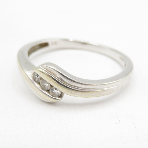 179 - 9ct white gold diamond twist ring (2g) size O 1/2