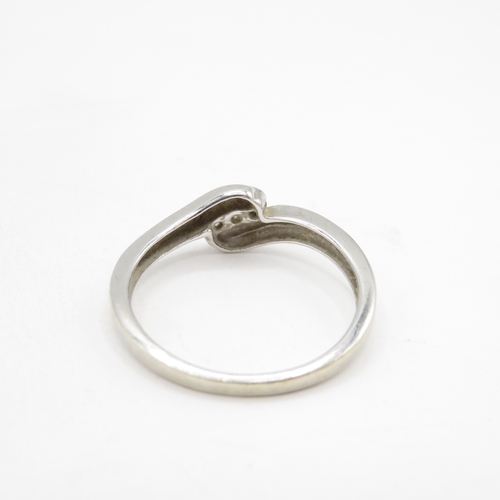 179 - 9ct white gold diamond twist ring (2g) size O 1/2