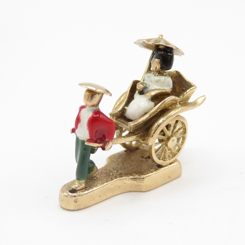 248 - 9ct gold rickshaw charm with enamel details (6g)