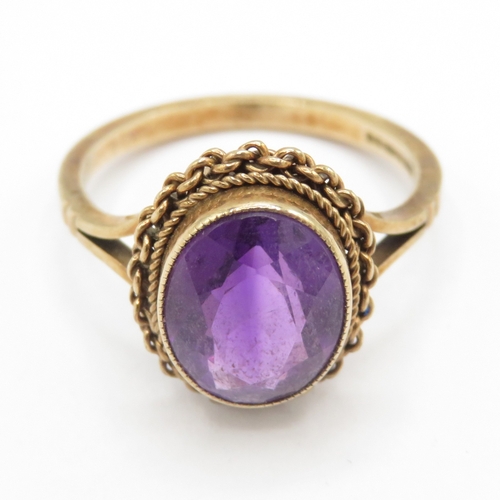 265 - 9ct gold amethyst solitaire ring with filigree details (3.1g) size N
