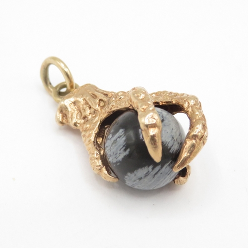 269 - 9ct gold eagles claw snowflake obsidian charm / pendant (4.1g)