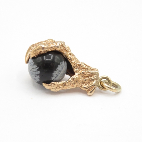 269 - 9ct gold eagles claw snowflake obsidian charm / pendant (4.1g)