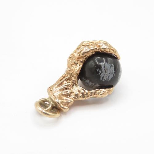 269 - 9ct gold eagles claw snowflake obsidian charm / pendant (4.1g)