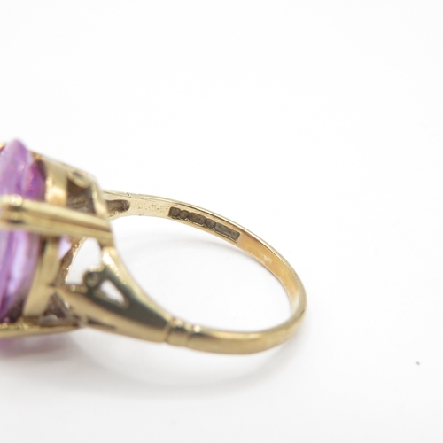 273 - 9ct gold purple gemstone dress ring (3.9g) size L