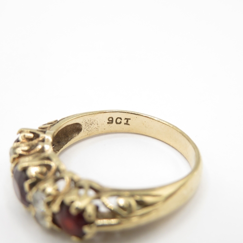 281 - 9ct gold garnet and white gemstone boat ring (3.9g) size P