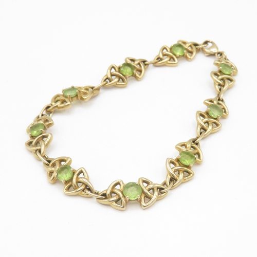 285 - 9ct gold peridot Celtic link bracelet (11.4g)