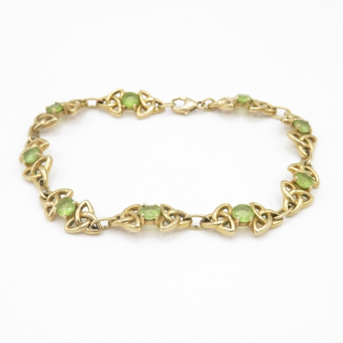 285 - 9ct gold peridot Celtic link bracelet (11.4g)