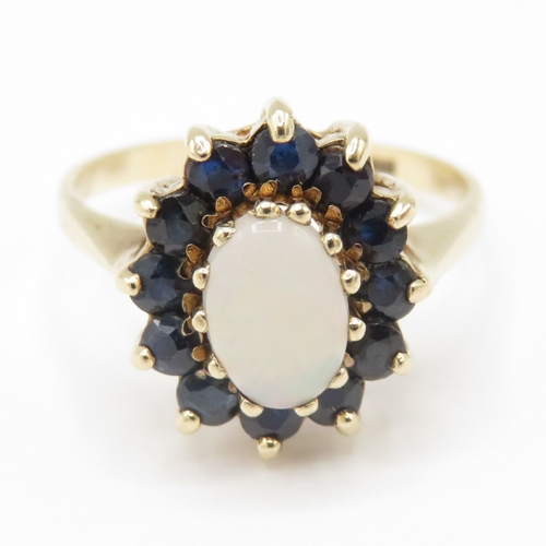 290 - 9ct gold opal and sapphire halo ring (2.7g) size N