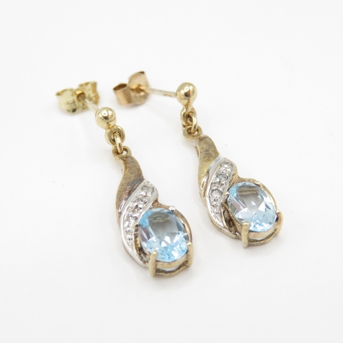 294 - 9ct gold diamond and topaz drop earrings (1.8g)
