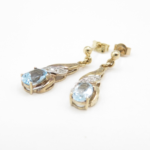 294 - 9ct gold diamond and topaz drop earrings (1.8g)