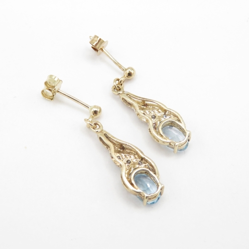 294 - 9ct gold diamond and topaz drop earrings (1.8g)
