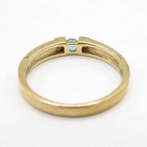 295 - 9ct gold blue gemstone tension set ring with diamond shoulders (1.8g) size J