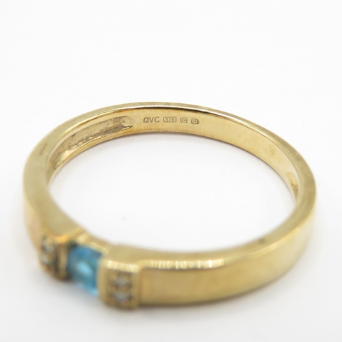 295 - 9ct gold blue gemstone tension set ring with diamond shoulders (1.8g) size J