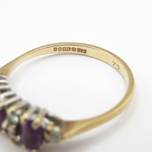 296 - 9ct gold purple and white gemstone ring (1.7g) size N