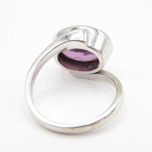 300 - 9ct white gold oval amethyst ring with wrap around bezel (5.4g) size L 1/2