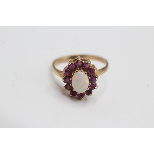 13 - 9ct gold ruby and opal halo ring (2.2g) Size M