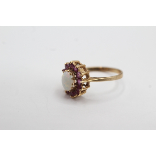 13 - 9ct gold ruby and opal halo ring (2.2g) Size M