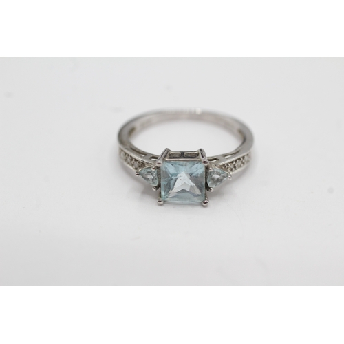 15 - 9ct white gold topaz and diamond dress ring (2.4g) Size M