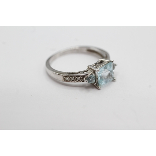 15 - 9ct white gold topaz and diamond dress ring (2.4g) Size M