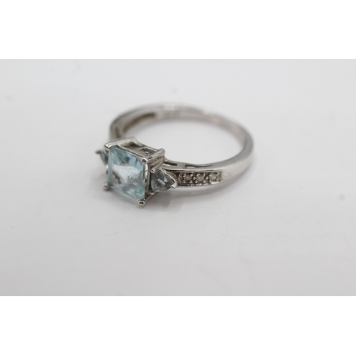 15 - 9ct white gold topaz and diamond dress ring (2.4g) Size M