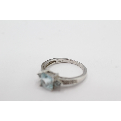 15 - 9ct white gold topaz and diamond dress ring (2.4g) Size M
