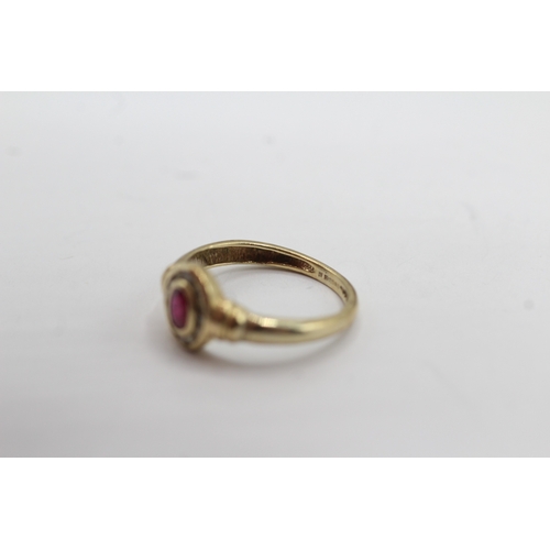 29 - 9ct gold diamond and ruby halo ring (1.3g) Size H 1/2