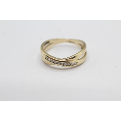 36 - 9ct gold diamond cross-over ring (2.2g) Size N