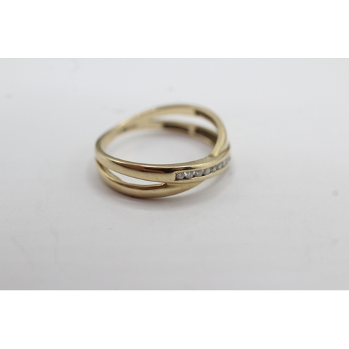 36 - 9ct gold diamond cross-over ring (2.2g) Size N