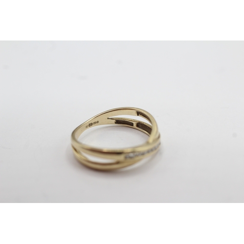 36 - 9ct gold diamond cross-over ring (2.2g) Size N