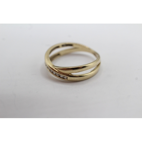 36 - 9ct gold diamond cross-over ring (2.2g) Size N