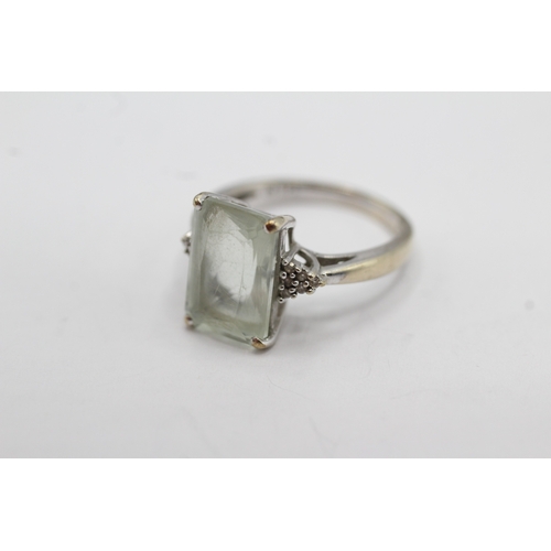 45 - 9ct gold diamond and prasiolite cocktail ring (3.5g) Size L