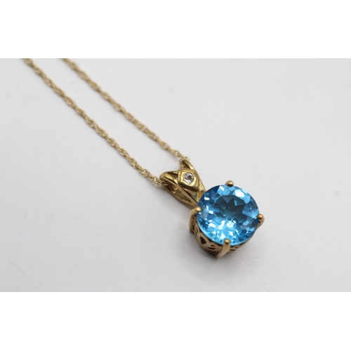 5 - 9ct gold blue topaz pendant necklace (3.2g)