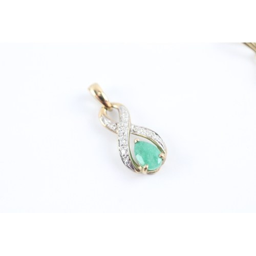 50 - 2x 9ct gold emerald diamond pendants (1.3g)