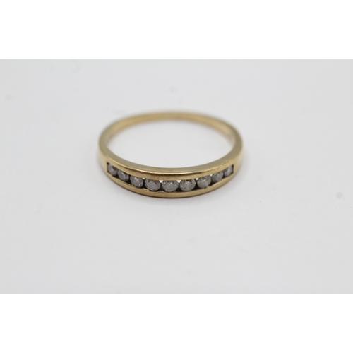 58 - 9ct gold channel set diamond ring (1.6g) Size M