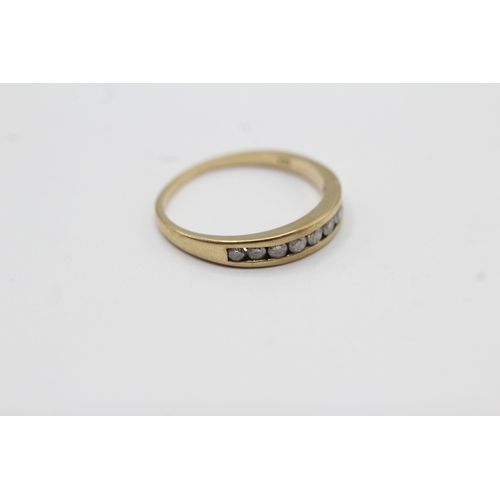58 - 9ct gold channel set diamond ring (1.6g) Size M