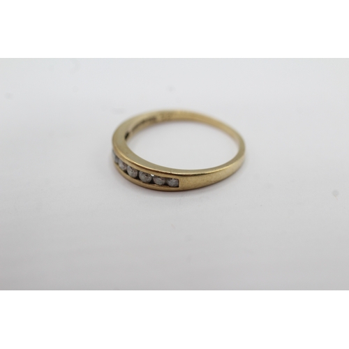 58 - 9ct gold channel set diamond ring (1.6g) Size M